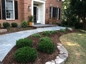 New Paver installation leading up to residential brick home