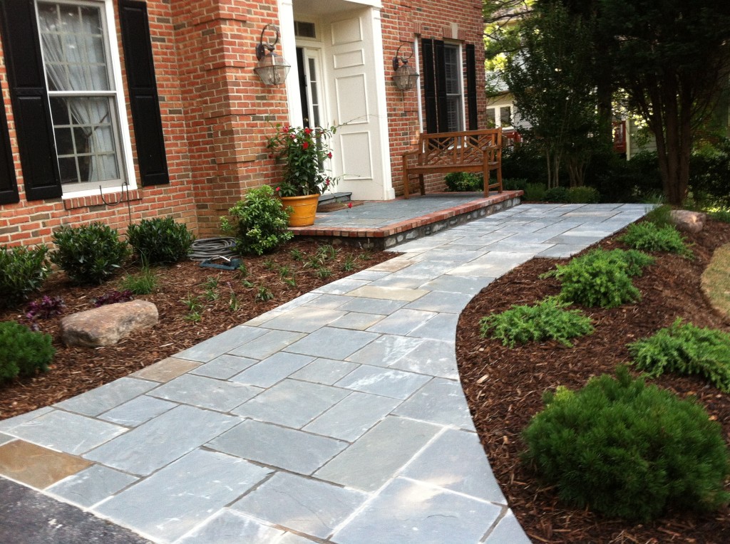 New Paver installation leading up to residential brick home