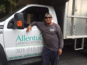 Horacio Standing beside Allentuck Landscaping Truck