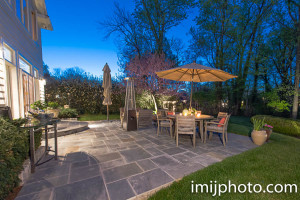 Backyard with patio furniture at dusk