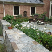 Raised stonework flowerbeds