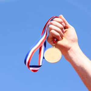 Olympic gold medal in a hand