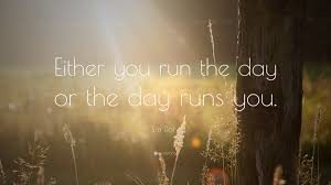 Graphic showing text "either you run the day or the day runs you"
