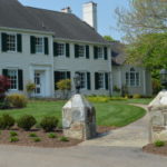 Entry to a large well designed and landscaped yard