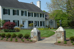 Entry to a large well designed and landscaped yard