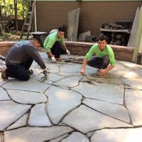 allentuck Landscaping team putting the finishing touches on a project