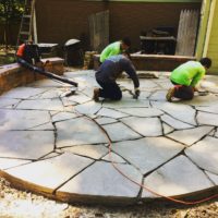 allentuck landscaping team working on new stone paver patio