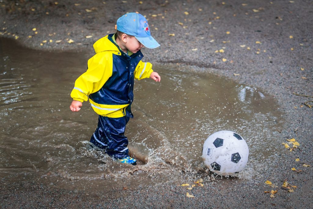 Child Playing in a puddle
