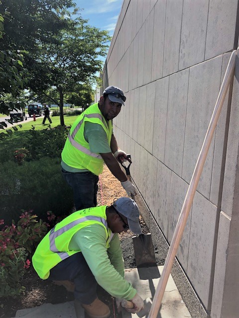 Allentuck Landscaping team working on paver path