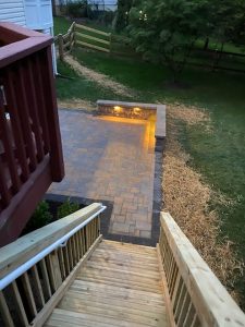 patio installation with outdoor lighting viewed from deck