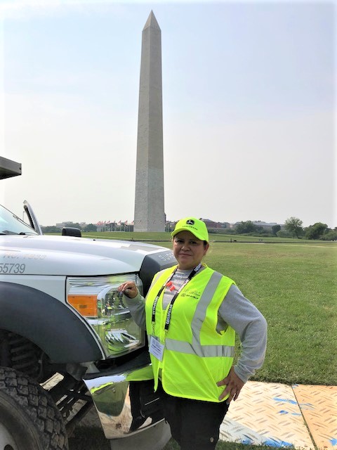 allentuck landscaping team member standing besdie their branded truck