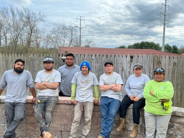 Allentuck landscaping team resting after building a retaining wall