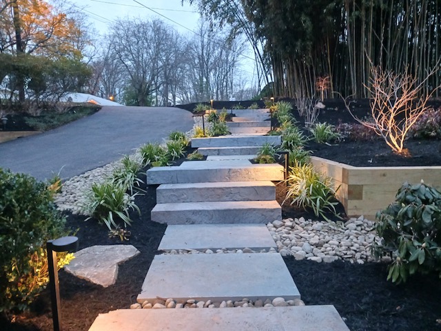 landscaped design with new steps, mulch, and plants