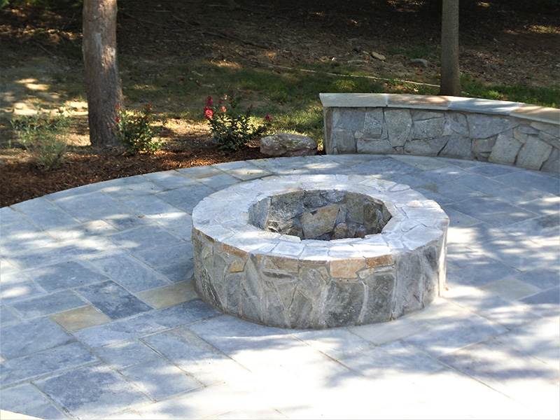 stone fire pit and patio installation