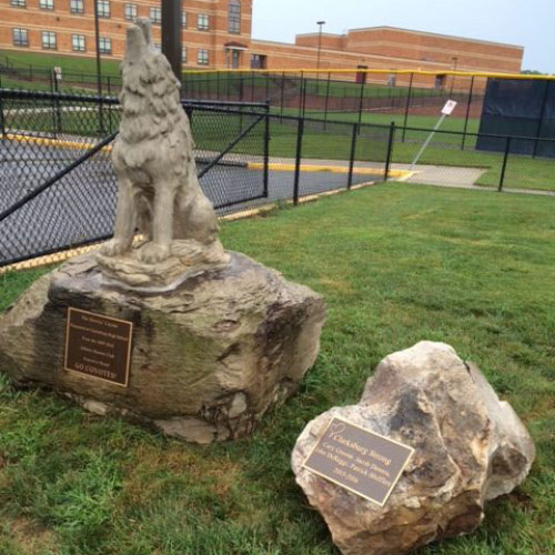 A statue of a wolf by hardscape contractors