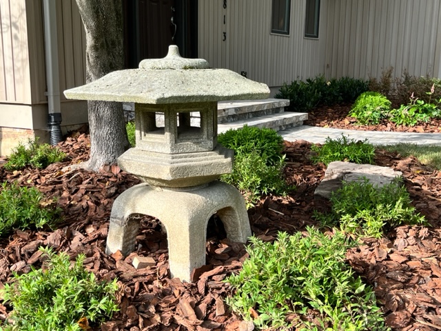 a Japanese concrete lantern built as part of a hardscape project