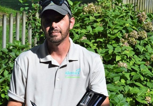 Allentuck landscaping employee with his folio notepad Allentuck landscaping employee with his folio notepad